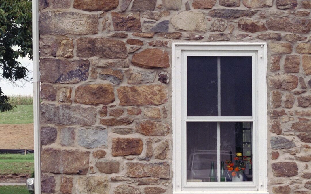 A closer view of the fieldstone house.