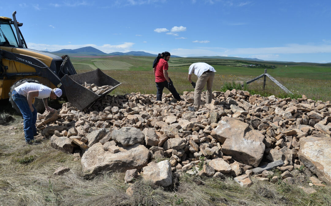 Stone from the piles is hand-picked for processing.